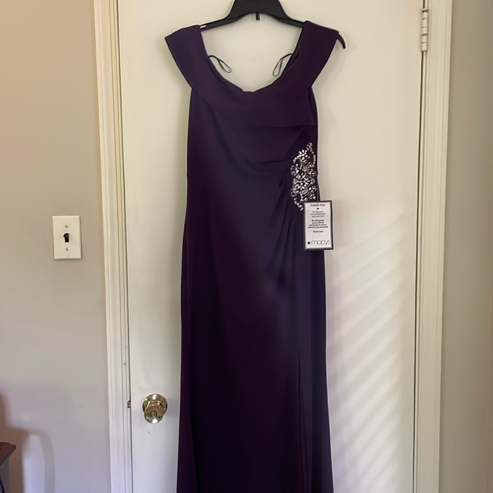 Beautiful plum formal dress. New with tags.